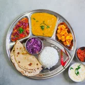 Compartment plate with daal, roti, rice and two sabzis