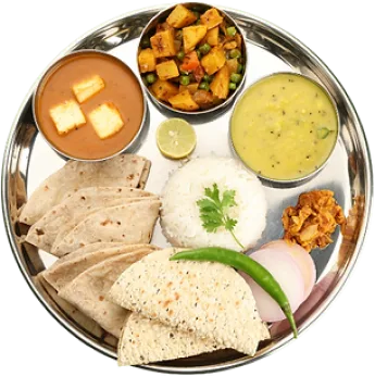 Steel plate with daal, roti, rice, paneer and aloo-matar sabzi